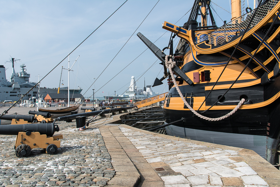 The Victory at naval museum with present day ships at rear at naval dockyard