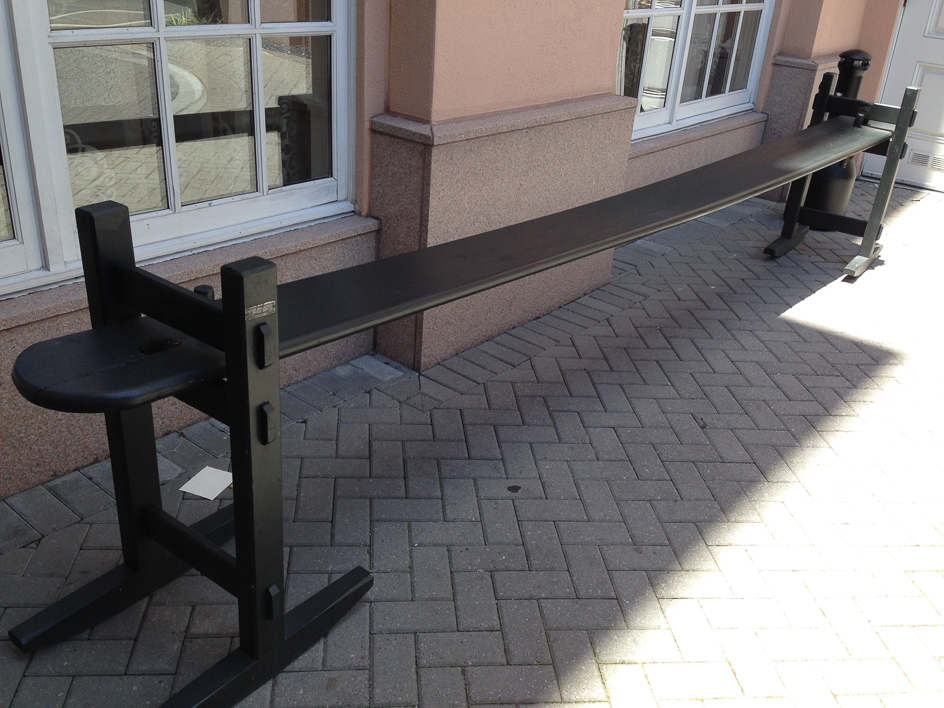 Common bench that sways side to side, often outside restaurants.